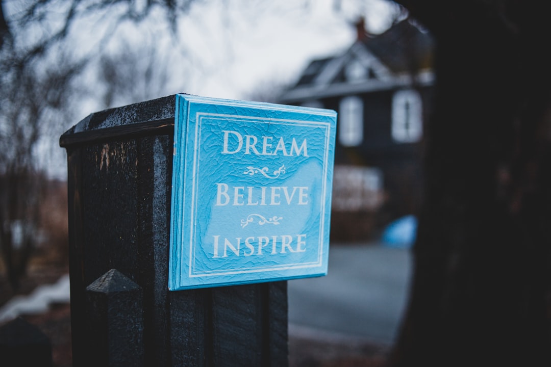 Quote posted outside, that says'Dream. Believe. Inspire.'